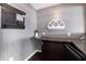 This office space features a granite desk, decorative wall art, and dark brown cabinetry at 12959 Balfour Rd, Fishers, IN 46037