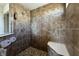 Tiled walk-in shower featuring a built-in bench and showerhead, offering a relaxing experience at 12959 Balfour Rd, Fishers, IN 46037