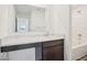 Bathroom with vanity featuring dark wood cabinets and light countertop next to shower and tub at 13752 N George Ct, Camby, IN 46113