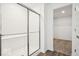 Modern bathroom with glass-enclosed shower and large closet with shelving at 13752 N George Ct, Camby, IN 46113