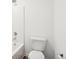 Bright bathroom featuring a sleek toilet, shower, and modern fixtures at 13752 N George Ct, Camby, IN 46113