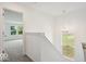 Hallway features white walls, carpeted floors, a window, and modern lighting at 13752 N George Ct, Camby, IN 46113
