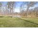 A serene pond with a grassy lawn and trees surrounding the area at 1527 Canyon Oak Ln, Columbus, IN 47201