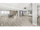 Finished basement featuring a wet bar with storage, wood flooring, and recessed lighting at 1527 Canyon Oak Ln, Columbus, IN 47201
