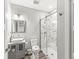 Bathroom featuring a glass enclosed shower, a vessel sink, and tile flooring at 1527 Canyon Oak Ln, Columbus, IN 47201