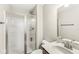 Bathroom featuring a glass shower stall, white toilet and sink with faucet and mirror at 1527 Canyon Oak Ln, Columbus, IN 47201
