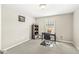 A cozy bedroom featuring a desk, chair, and natural light from the window at 1527 Canyon Oak Ln, Columbus, IN 47201