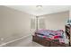 A bright bedroom featuring a bed with built-in storage and natural light at 1527 Canyon Oak Ln, Columbus, IN 47201