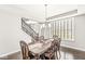 Traditional dining room with elegant wood table set and bright window lighting at 1527 Canyon Oak Ln, Columbus, IN 47201