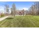 Beautiful brick two-story home featuring a well-manicured lawn and professional landscaping at 1527 Canyon Oak Ln, Columbus, IN 47201