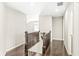 A well-lit hallway with hardwood floors and classic wood railings at 1527 Canyon Oak Ln, Columbus, IN 47201