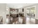 Stylish kitchen with island seating, stainless appliances, and deck access via sliding doors at 1527 Canyon Oak Ln, Columbus, IN 47201
