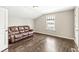 A comfortable living room with vaulted ceilings, hardwood floors and natural light at 1527 Canyon Oak Ln, Columbus, IN 47201