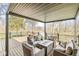 Relaxing covered outdoor seating area with views of the peaceful pond and trees at 1527 Canyon Oak Ln, Columbus, IN 47201