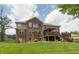 This lovely home features a brick and siding exterior and a spacious back deck perfect for entertaining at 1527 Canyon Oak Ln, Columbus, IN 47201