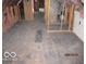 Spacious attic featuring exposed beams, pink insulation, and hardwood flooring at 1546 S New Jersey St, Indianapolis, IN 46225