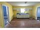 This expansive yellow kitchen boasts ample cabinet space, counterspace, and a double-basin sink at 1546 S New Jersey St, Indianapolis, IN 46225