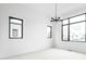 Serene bedroom featuring a modern chandelier, ample natural light, and neutral walls, ideal for relaxation at 17354 Newton Main St, Westfield, IN 46074