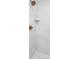 Modern shower featuring white textured tile, a corner shelf, hexagon tile floor, and brushed gold fixtures at 17354 Newton Main St, Westfield, IN 46074