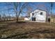 Image showing the home's backyard featuring a patio and a lawn, enclosed by a well-maintained fence at 1808 Raible Ave, Anderson, IN 46011