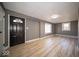 Bright living room with modern floors, neutral paint, and a large window at 1808 Raible Ave, Anderson, IN 46011