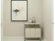 Bright laundry room features a storage cart, neutral wall art, and tiled floor at 19585 Boulder Brook Ln, Westfield, IN 46074