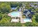 Aerial view of a community pool with lounge chairs, a diving board and clubhouse at 2183 Glebe St, Carmel, IN 46032