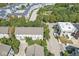 Aerial view of the home surrounded by trees, showcasing the neighborhood layout and nearby buildings at 2183 Glebe St, Carmel, IN 46032