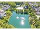 Aerial view of lake and community amenities including a pool and clubhouse at 2183 Glebe St, Carmel, IN 46032