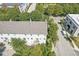 Aerial view showcases a well-maintained home, lush trees, and the surrounding neighborhood streets at 2183 Glebe St, Carmel, IN 46032