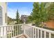 Balcony view featuring tree-lined street in a quiet, charming neighborhood setting with blue skies at 2183 Glebe St, Carmel, IN 46032