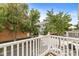 Balcony view showcasing tree-lined street and neighboring building in a serene, residential environment at 2183 Glebe St, Carmel, IN 46032