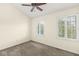Inviting bedroom featuring neutral walls, carpet, and shuttered windows providing great natural light at 2183 Glebe St, Carmel, IN 46032