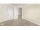 Spacious bedroom with neutral walls, carpet, and double door closet providing ample storage at 2183 Glebe St, Carmel, IN 46032