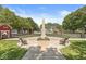 A community park featuring a central monument, playground, benches, and inviting green spaces at 2183 Glebe St, Carmel, IN 46032