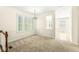 Cozy dining room features neutral walls, large windows, and a stylish chandelier at 2183 Glebe St, Carmel, IN 46032
