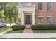 Classic townhouse entrance with brick walkway, and neat landscaping at 2183 Glebe St, Carmel, IN 46032