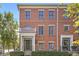 Charming brick townhouse with a covered front porch and well-maintained landscaping at 2183 Glebe St, Carmel, IN 46032