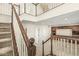 Spacious two-story foyer, offering a grand entry to the home with staircase at 2183 Glebe St, Carmel, IN 46032