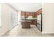Charming kitchen with stainless steel appliances, dark wood cabinets, and tiled floors at 2183 Glebe St, Carmel, IN 46032
