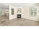 Inviting living room with tiled floors, fireplace, and natural light from the shuttered window at 2183 Glebe St, Carmel, IN 46032