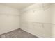 This walk-in closet offers ample storage with sturdy shelving and a clean, well-organized design at 2183 Glebe St, Carmel, IN 46032