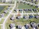 Aerial neighborhood view featuring homes with manicured lawns, and a house marked with a red pin at 2314 Angelina Way, Greenwood, IN 46143