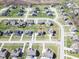 Aerial view of a neighborhood featuring a highlighted home amid manicured lawns and tree-lined streets at 2314 Angelina Way, Greenwood, IN 46143