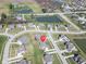 Beautiful aerial view of a home in a well-planned community with mature trees, ponds, and green space at 2314 Angelina Way, Greenwood, IN 46143