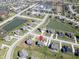Comprehensive aerial view of a neighborhood with pond, highlighting a home with a red pinpoint at 2314 Angelina Way, Greenwood, IN 46143
