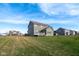 An expansive backyard featuring a well-maintained lawn and the rear exterior of a two-story home at 2314 Angelina Way, Greenwood, IN 46143