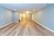 This is a view of the finished basement with wood floors, recessed lights, and lots of space for recreation at 2314 Angelina Way, Greenwood, IN 46143