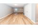 View of the basement with hard wood flooring, recessed lighting, neutral colored paint and a single window at 2314 Angelina Way, Greenwood, IN 46143