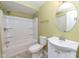 This bathroom features a single sink with vanity and toilet next to a shower tub combination with tile floors at 2314 Angelina Way, Greenwood, IN 46143